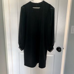 Zara black dress with sheer sleeves and fun wrist detail. Falls above the knee.